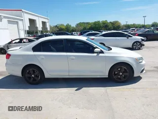 2012 Volkswagen Jetta Sedan SE w/Convenience with VIN 3VWDX7AJ3CM392032, listed as a IAAI auction lot 41825344 with 177,581 mi miles. Bid and sale history available at carsss.com. Image 13.