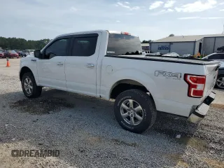 2018 Ford F-150 XL with VIN 1FTEW1E59JFA28036, listed as a Copart auction lot 57181525 with 121,384 mi miles and Salvage title. Bid and sale history available at DreamBid. Image 2.