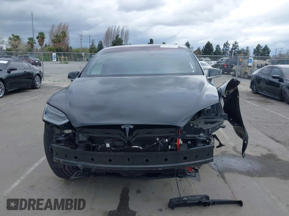 2017 Tesla Model X 90D with VIN 5YJXCAE2XHF075341, listed as a IAAI auction lot 41784008 with 77,439 mi miles and . Bid and sale history available at DreamBid. Image 13.
