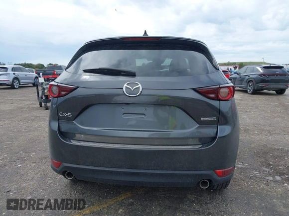 2021 Mazda CX-5 Touring with VIN JM3KFACM1M0461510, listed as a IAAI auction lot 41660439 with 30,352 mi miles. Bid and sale history available at carsss.com. Image 16.