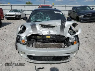 2013 MINI Coupe S z VIN WMWSX3C5XDT466209, wystawiony jako Copart lot #67072444 z przebiegiem 145 900 mil mil oraz Szkody całkowita. Historia ofert i sprzedaży dostępna na DreamBid. Obrazek 5.