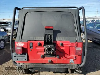 2002 Jeep Wrangler X with VIN 1J4FA39S32P771120, listed as a Copart auction lot 42636665 with 153,168 mi miles and Salvage Title. Bid and sale history available at carsss.com. Image 6.