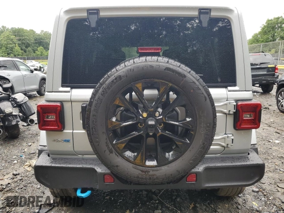 2024 Jeep Wrangler Sahara with VIN 1C4RJXP65RW210689, listed as a Copart auction lot 66482724 with 4,872 mi miles and Salvage Title. Bid and sale history available at DreamBid. Image 6.