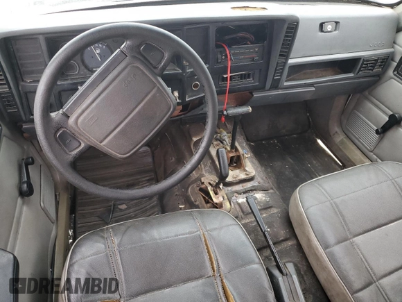 1996 Jeep Cherokee SE z VIN 1J4FJ28S7TL256478, wystawiony jako Copart lot #47164985 z przebiegiem 195 800 mil mil oraz Nie do naprawy • Non repairable. Historia ofert i sprzedaży dostępna na DreamBid. Obrazek 8.