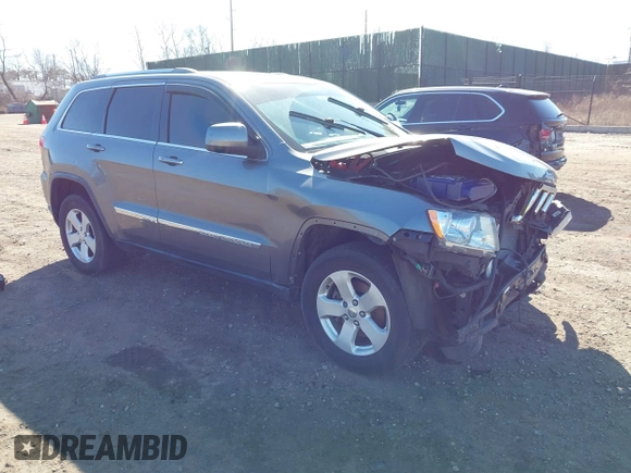 2012 Jeep Grand Cherokee Laredo with VIN 1C4RJFAG0CC145061, listed as a IAAI auction lot 41820140 with 185,015 mi miles. Bid and sale history available at carsss.com. Image 1.
