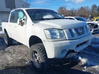2012 Nissan Titan SV with VIN 1N6BA0EJ0CN309933, listed as a IAAI auction lot 41472091 with 147,635 mi miles. Bid and sale history available at carsss.com. Image 1.