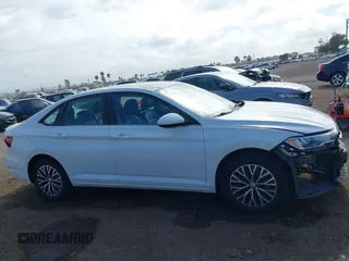 2021 Volkswagen Jetta S z VIN 3VWC57BU9MM034560, wystawiony jako IAAI lot #42239655 z przebiegiem 75 424 mil mil oraz . Historia ofert i sprzedaży dostępna na DreamBid. Obrazek 14.