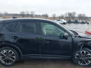 2016 Mazda CX-5 Grand Touring with VIN JM3KE4DY3G0769448, listed as a IAAI auction lot 41947725 with 154,051 mi miles and . Bid and sale history available at carsss.com. Image 13.