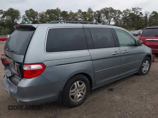 2005 Honda Odyssey EX-L with VIN 5FNRL38625B041067, listed as a IAAI auction lot 40519464 with 117,606 mi miles and . Bid and sale history available at carsss.com. Image 4.