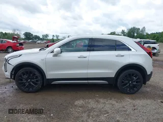 2022 Cadillac XT4 AWD Premium Luxury z VIN 1GYFZDR42NF128199, wystawiony jako IAAI lot #42522314 z przebiegiem 29 002 mil mil oraz . Historia ofert i sprzedaży dostępna na DreamBid. Obrazek 14.