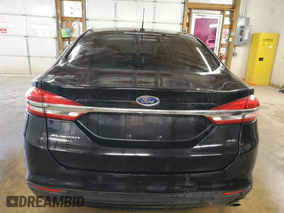2018 Ford Fusion SE z VIN 3FA6P0H77JR277923, wystawiony jako Copart lot #56897455 z przebiegiem 154 432 mil mil oraz Czysty tytuł • Clean title. Historia ofert i sprzedaży dostępna na DreamBid. Obrazek 6.