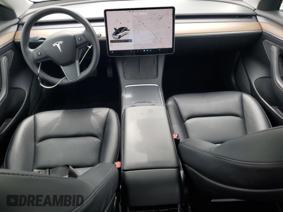 2021 Tesla Model 3 Standard Range Plus with VIN 5YJ3E1EA7MF087909, listed as a Copart auction lot 50942395 with 16,591 mi miles and Salvage Title. Bid and sale history available at carsss.com. Image 8.
