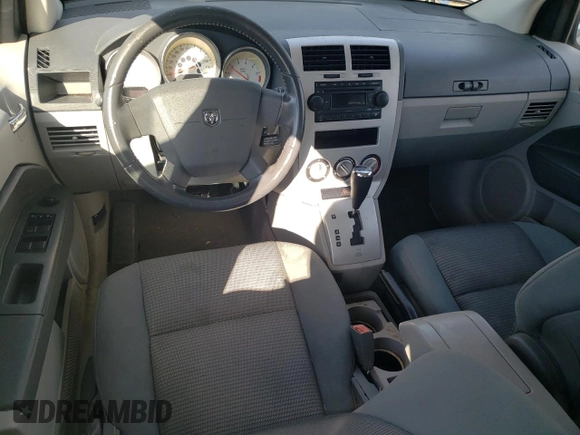 2007 Dodge Caliber R/T z VIN 1B3HB78K07D243730, wystawiony jako Copart lot #87064294 z przebiegiem 201 196 mil mil oraz Tytuł czysty. Historia ofert i sprzedaży dostępna na DreamBid. Obrazek 8.