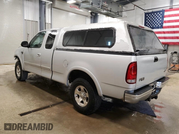 1999 Ford F-150 with VIN 1FTRX18W2XKB01444, listed as a Copart auction lot 52717195 with 210,581 mi miles and Clean title. Bid and sale history available at DreamBid. Image 2.