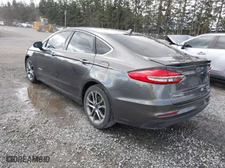 2019 Ford Fusion Hybrid Titanium with VIN 3FA6P0RU8KR273062, listed as a IAAI auction lot 41814102 with 70,877 mi miles. Bid and sale history available at carsss.com. Image 3.