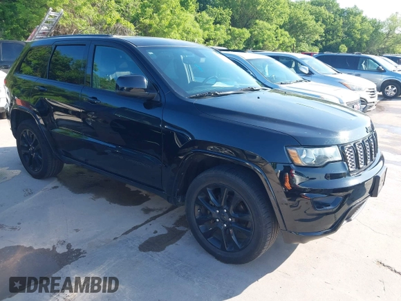 2017 Jeep Grand Cherokee Laredo with VIN 1C4RJFAGXHC817666, listed as a IAAI auction lot 42036817 with 119,698 mi miles. Bid and sale history available at carsss.com. Image 1.