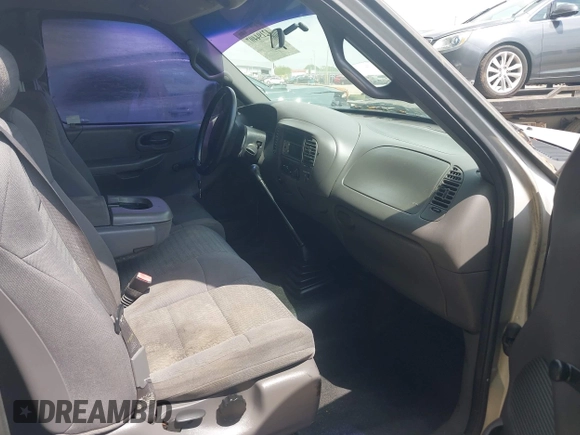 2001 Ford F-150 with VIN 2FTZX17221CB01390, listed as a IAAI auction lot 42194407 with 239,834 mi miles and . Bid and sale history available at DreamBid. Image 5.