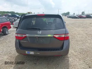 2012 Honda Odyssey EX-L with VIN 5FNRL5H60CB054277, listed as a IAAI auction lot 42459861 with 205,722 mi miles and . Bid and sale history available at DreamBid. Image 16.