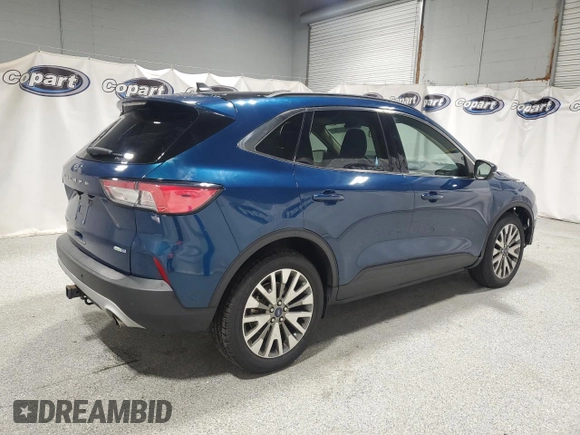 2020 Ford Escape Titanium z VIN 1FMCU9J98LUA93393, wystawiony jako Copart lot #65366925 z przebiegiem 74 750 mil mil oraz Czysty tytuł • Clean title. Historia ofert i sprzedaży dostępna na DreamBid. Obrazek 3.