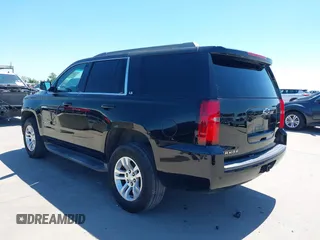 2015 Chevrolet Tahoe LS with VIN 1GNSCAKC5FR645736, listed as a IAAI auction lot 42064623 with 223,149 mi miles and . Bid and sale history available at DreamBid. Image 3.