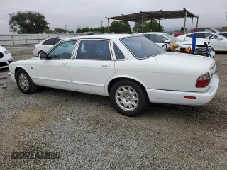 1999 Jaguar XJ with VIN SAJHX1040XC864208, listed as a Copart auction lot 59748585 with 130,577 mi miles and Clean title. Bid and sale history available at DreamBid. Image 2.