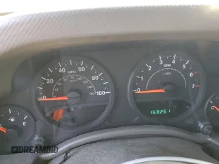 2009 Jeep Wrangler X with VIN 1J4FA24139L730383, listed as a Copart auction lot 51914935 with 168,265 mi miles and Salvage Title. Bid and sale history available at DreamBid. Image 9.