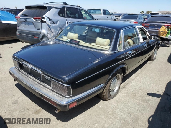1990 Jaguar XJ with VIN SAJKY1745LC622713, listed as a Copart auction lot 56545414 with Not Provided miles and Salvage Title. Bid and sale history available at DreamBid. Image 3.