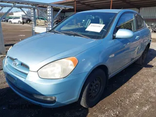 2007 Hyundai Accent SE with VIN KMHCN36CX7U031496, listed as a IAAI auction lot 41811183 with 201,740 mi miles. Bid and sale history available at carsss.com. Image 2.