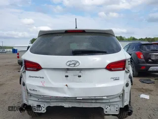 2018 Hyundai Santa Fe 2.4L z VIN 5NMZTDLB9JH060895, wystawiony jako IAAI lot #41939221 z przebiegiem 89 960 mil mil oraz . Historia ofert i sprzedaży dostępna na DreamBid. Obrazek 17.