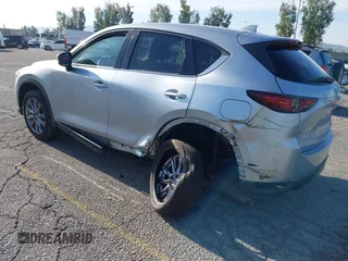 2021 Mazda CX-5 Grand Touring with VIN JM3KFADM1M1393251, listed as a IAAI auction lot 42072862 with 47,758 mi miles. Bid and sale history available at carsss.com. Image 3.