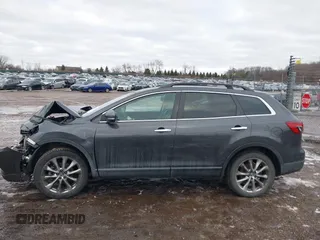 2015 Mazda CX-9 Grand Touring with VIN JM3TB2DAXF0447537, listed as a IAAI auction lot 41191694 with 157,113 mi miles. Bid and sale history available at carsss.com. Image 14.