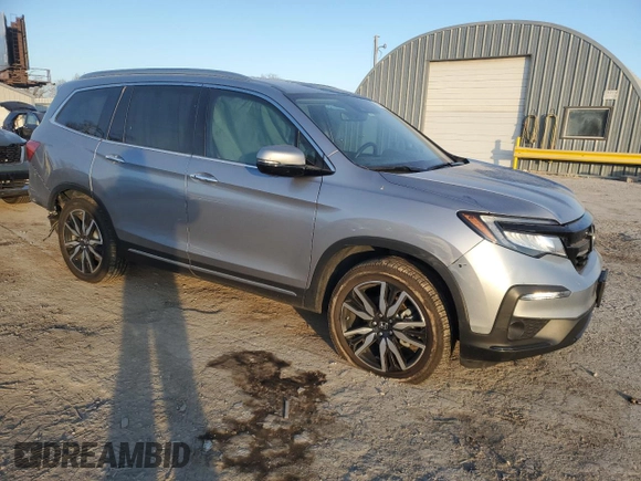 2020 Honda Pilot Touring 8-Passenger with VIN 5FNYF6H96LB029385, listed as a Copart auction lot 87391534 with 68,201 mi miles and Salvage Title. Bid and sale history available at DreamBid. Image 4.