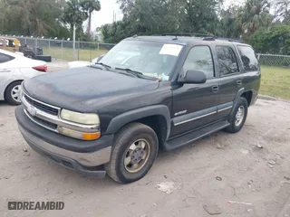 2003 Chevrolet Tahoe LT with VIN 1GNEC13Z93R296379, listed as a IAAI auction lot 41574575 with 301,567 mi miles. Bid and sale history available at carsss.com. Image 2.