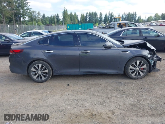 2016 Kia Optima SX Turbo z VIN 5XXGW4L28GG010897, wystawiony jako IAAI lot #42703779 z przebiegiem 121 918 mil mil oraz . Historia ofert i sprzedaży dostępna na DreamBid. Obrazek 14.