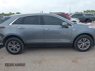 2021 Cadillac XT5 FWD Premium Luxury with VIN 1GYKNCRS5MZ128908, listed as a IAAI auction lot 41919571 with 51,280 mi miles and . Bid and sale history available at carsss.com. Image 14.