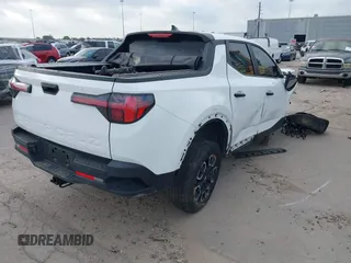 2022 Hyundai Santa Cruz SEL z VIN 5NTJBDAE5NH007005, wystawiony jako IAAI lot #42058065 z przebiegiem 30 825 mil mil oraz . Historia ofert i sprzedaży dostępna na DreamBid. Obrazek 4.