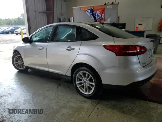 2018 Ford Focus SE with VIN 1FADP3F23JL214008, listed as a Copart auction lot 59692045 with 57,247 mi miles and Salvage title. Bid and sale history available at DreamBid. Image 2.