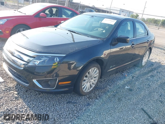 2012 Ford Fusion Hybrid z VIN 3FADP0L35CR371734, wystawiony jako IAAI lot #42559033 z przebiegiem 131 314 mil mil oraz . Historia ofert i sprzedaży dostępna na DreamBid. Obrazek 2.