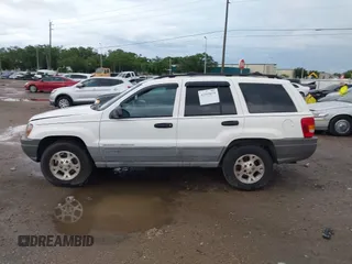 2000 Jeep Grand Cherokee Laredo z VIN 1J4G248S2YC339997, wystawiony jako IAAI lot #42395079 z przebiegiem 261 704 mil mil oraz . Historia ofert i sprzedaży dostępna na DreamBid. Obrazek 14.