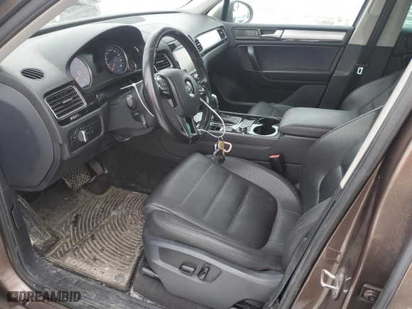 2012 Volkswagen Touareg Sport with VIN WVGEF9BP8CD006057, listed as a Copart auction lot 47739265 with 213,580 mi miles and Salvage Title. Bid and sale history available at carsss.com. Image 7.
