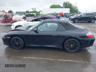 2005 Porsche 911 Carrera z VIN WP0CA299X5S650179, wystawiony jako IAAI lot #42123937 z przebiegiem 52 437 mil mil oraz . Historia ofert i sprzedaży dostępna na DreamBid. Obrazek 14.