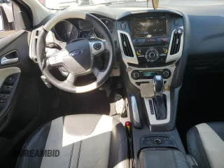 2014 Ford Focus Titanium with VIN 1FADP3J26EL132223, listed as a Copart auction lot 71490004 with 131,233 mi miles and Salvage Title. Bid and sale history available at DreamBid. Image 8.