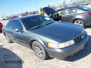 2003 Cadillac Seville Luxury SLS z VIN 1G6KS54Y43U158390, wystawiony jako IAAI lot #41977830 z przebiegiem 299 000 mil mil oraz . Historia ofert i sprzedaży dostępna na DreamBid. Obrazek 1.