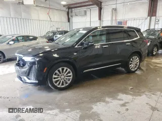 2020 Cadillac XT6 FWD Premium Luxury with VIN 1GYKPCRS2LZ229851, listed as a Copart auction lot 58633975 with 71,357 mi miles and Salvage title. Bid and sale history available at DreamBid. Image 1.