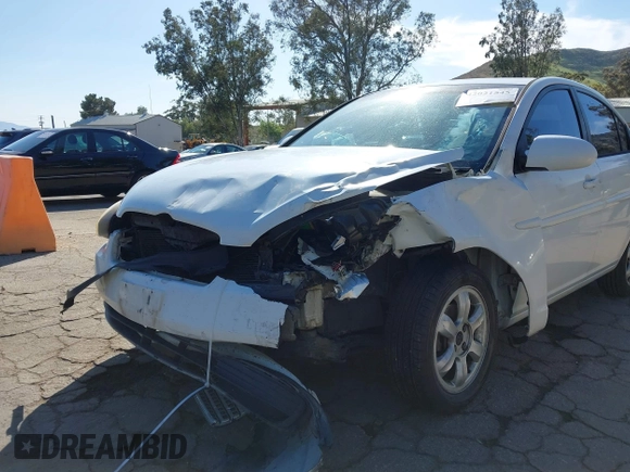 2006 Hyundai Accent GLS with VIN KMHCN46C36U040545, listed as a IAAI auction lot 42021545 with 224,058 mi miles. Bid and sale history available at carsss.com. Image 6.