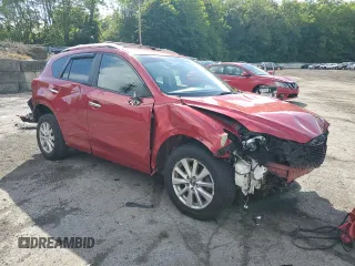 2015 Mazda CX-5 Sport with VIN JM3KE4BY9F0479748, listed as a Copart auction lot 58847805 with 122,698 mi miles and Salvage title. Bid and sale history available at DreamBid. Image 4.