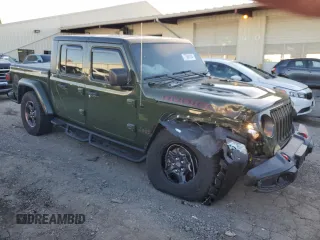 2021 Jeep Gladiator Rubicon with VIN 1C6JJTBM1ML599103, listed as a Copart auction lot 77084134 with 16,031 mi miles and Salvage title. Bid and sale history available at DreamBid. Image 4.