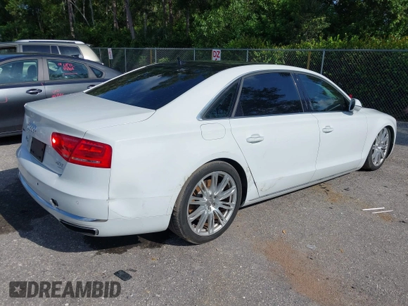2014 Audi A8 4.0T with VIN WAUR2AFD8EN004371, listed as a IAAI auction lot 42693492 with 159,405 mi miles and . Bid and sale history available at DreamBid. Image 4.