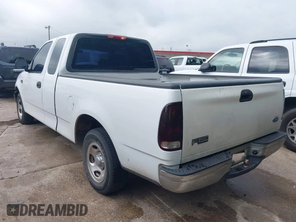 2002 Ford F-150 XL with VIN 1FTRX17202NA10047, listed as a IAAI auction lot 42122396 with 1 mi miles. Bid and sale history available at carsss.com. Image 3.