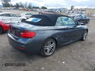 2016 BMW 2 Series 228i xDrive with VIN WBA1L9C5XGV767324, listed as a IAAI auction lot 41795604 with 133,276 mi miles. Bid and sale history available at carsss.com. Image 4.
